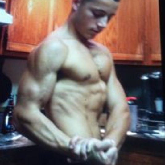 young man showing muscles | virtual personal trainer, online fitness program, affordable personal trainer