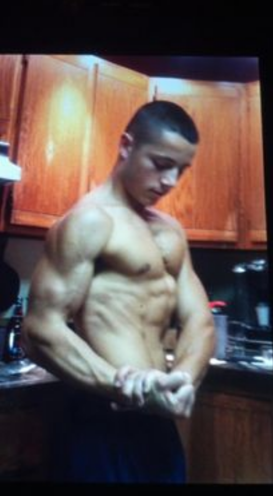 young man showing muscles | virtual personal trainer, online fitness program, affordable personal trainer